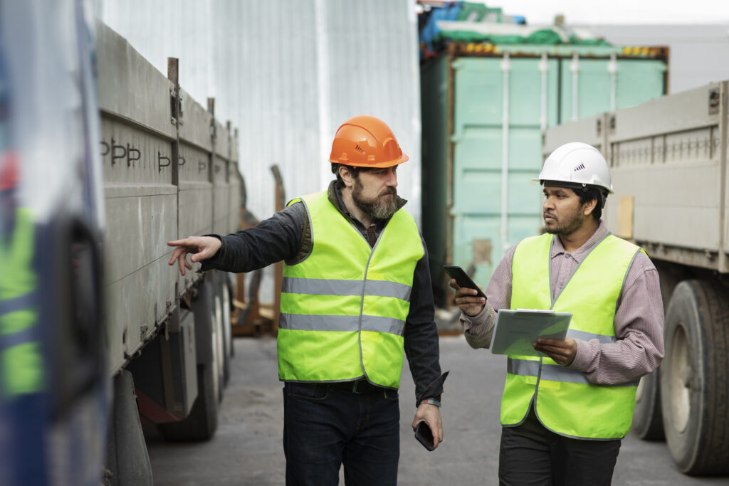 medium shot men looking truck medium shot men looking truck